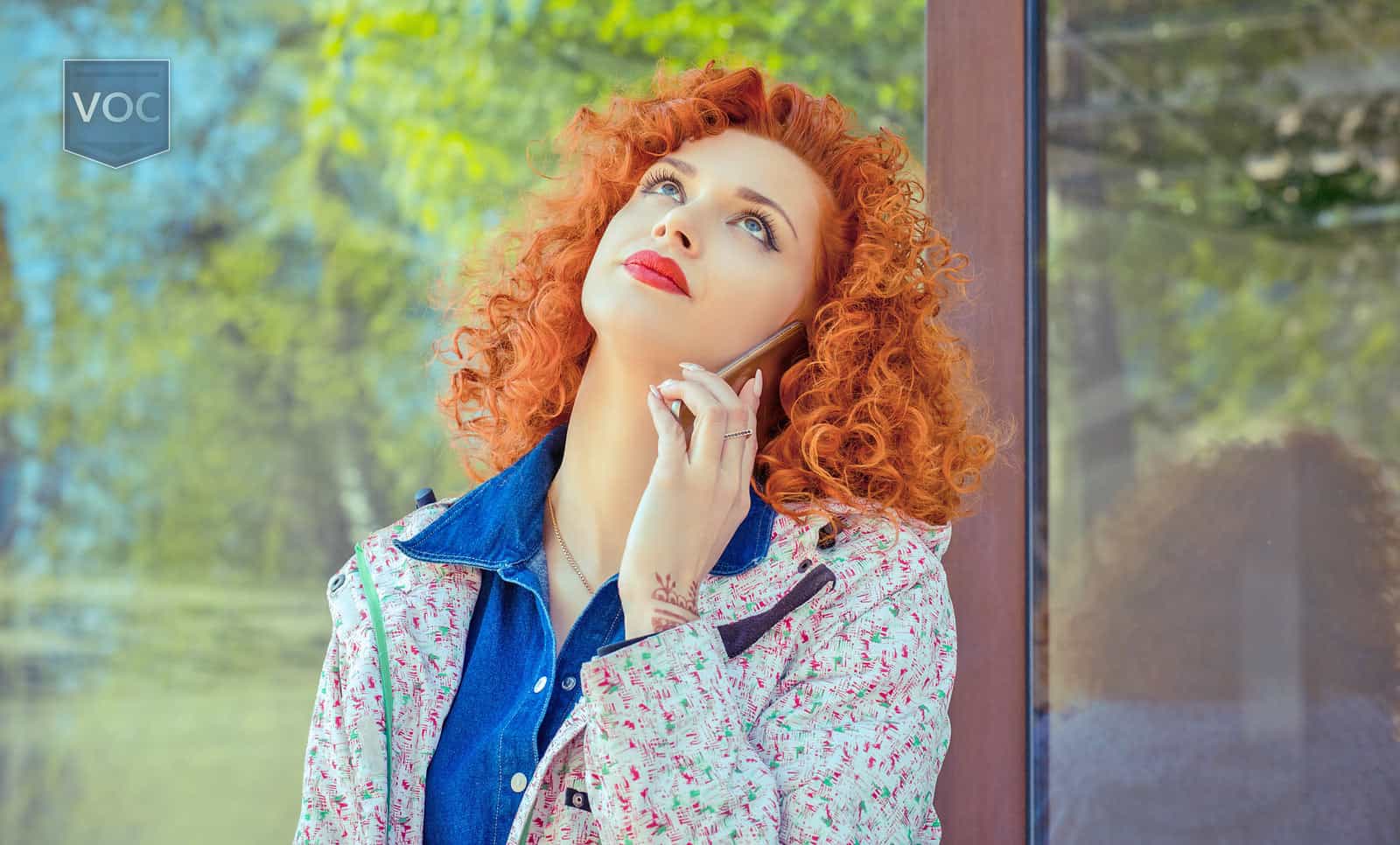 red-head-woman-being-harrassed-while-shes-on-the-phone-with-timeshare-exit-services-company