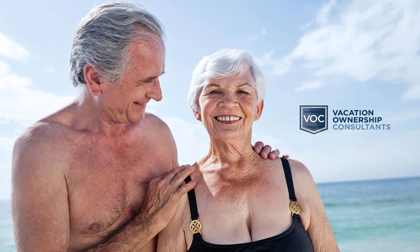happy-senior-couple-at-beach-finally-enjoying-vacation-after-canceling-their-timeshare-agreement-with-vacation-ownership-consultants