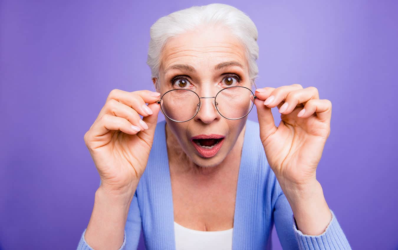 deja-vu-look-by-aging-woman-in-glasses-zooming-on-surprised-look-because-of-facts-around-giving-away-timeshares
