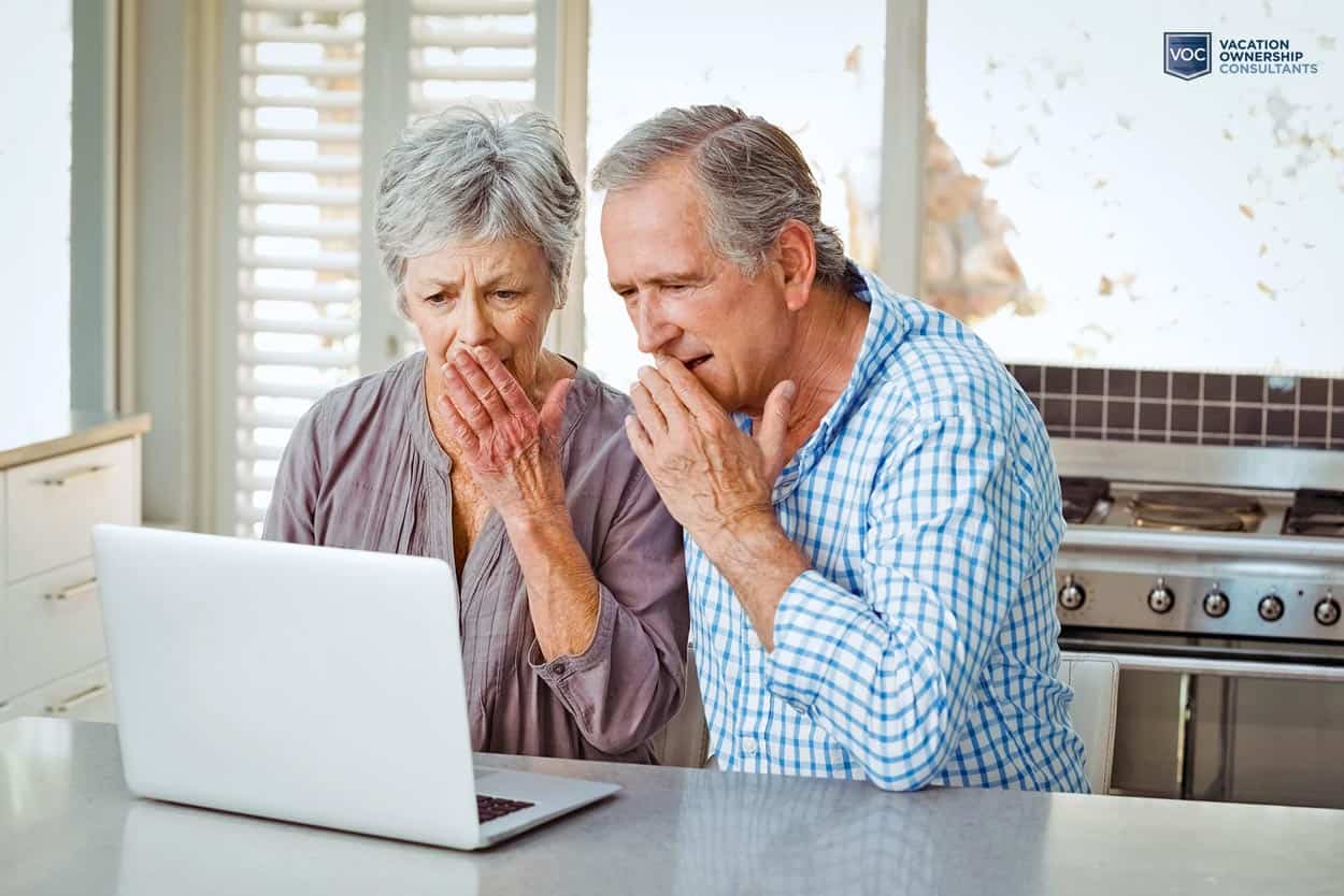 aging-married-couple-reviewing-vacation-information-online-and-astonished-at-what-someone-tells-them-about-timeshare-ownership
