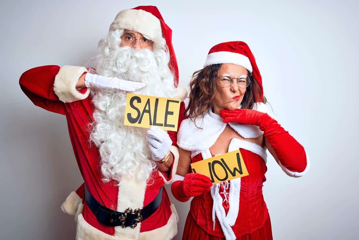 santa-and-wife-dressed-in-christmas-gear-promoting-travel-sales-for-potential-timeshare-owners-during-holiday-season