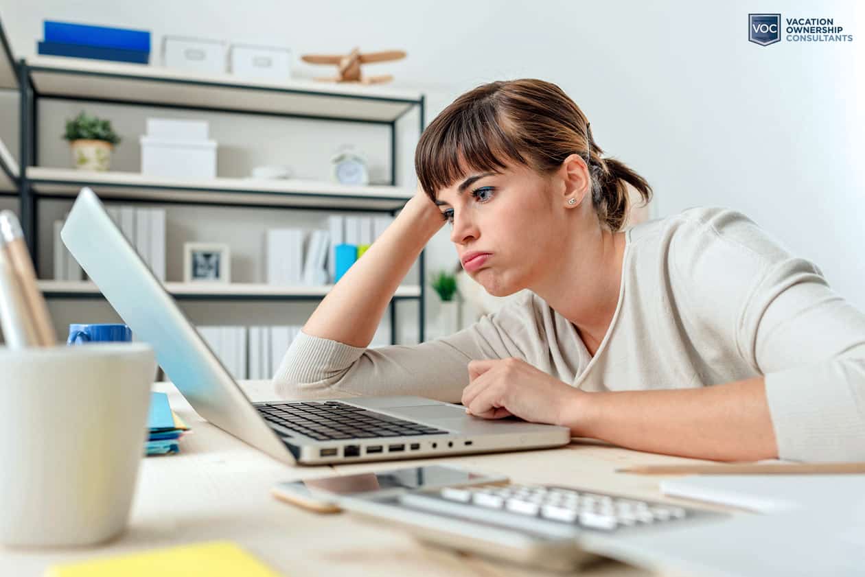 younger-gal-frustrated-with-results-on-laptop-computer-at-home-office-for-passive-timeshare-income-resale-failure
