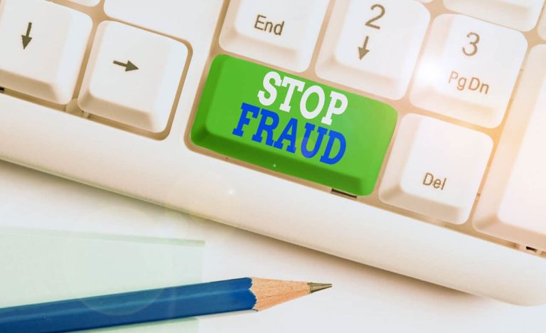 keyboard-with-green-button-stating-stop-fraud-pertaining-tp-lawsuit-by-elderly-woman-for-resale-scam