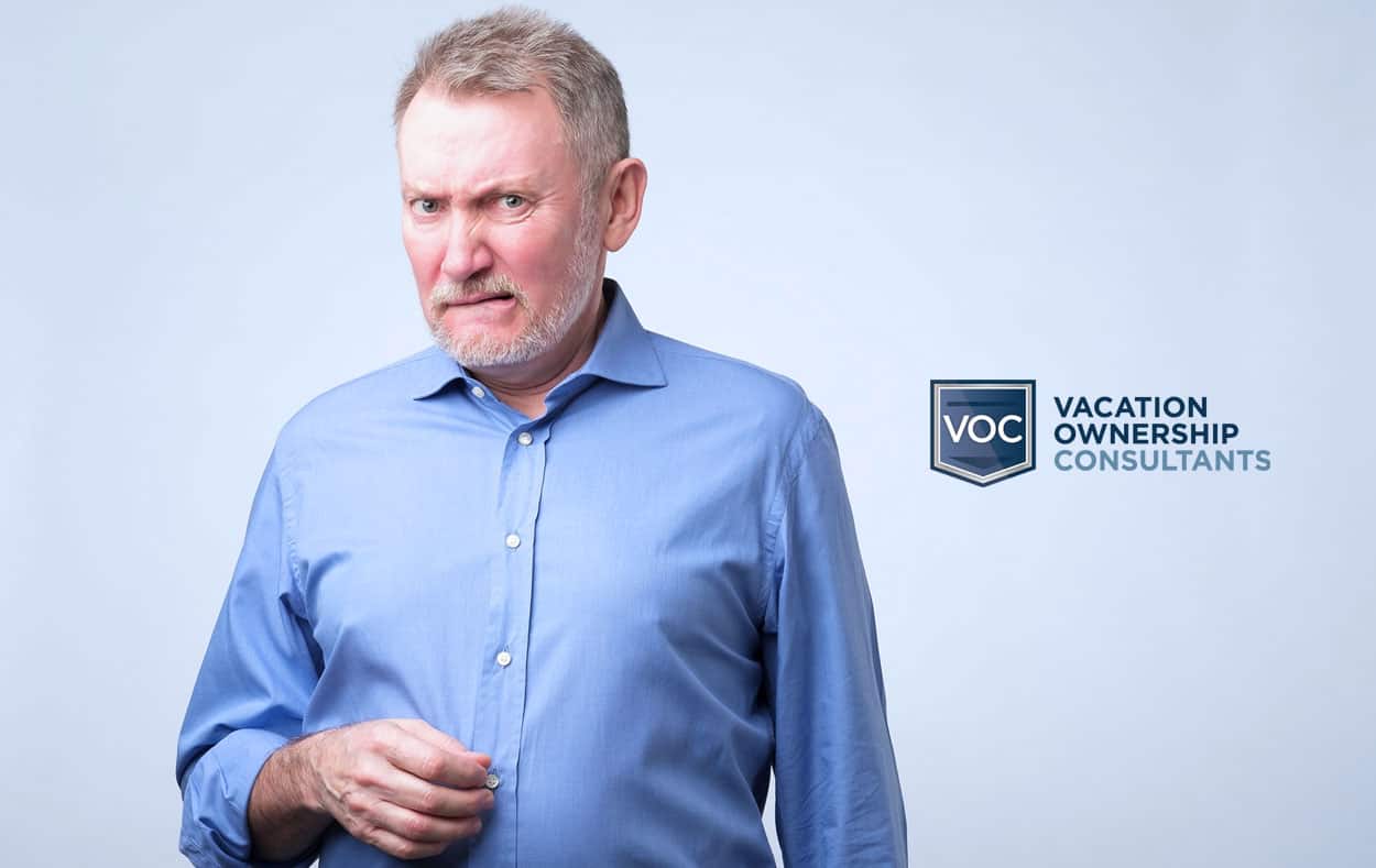 aging man with beard looking borderline angry after finding out news about potential lie