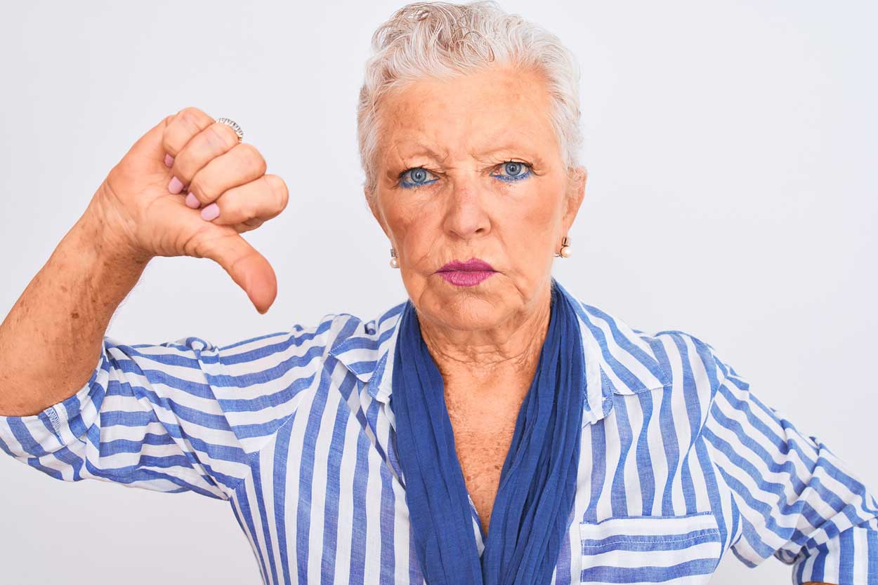 upset-grandmother-waiving-fist-at-the-idea-of-staying-home-from-timeshare-during-holidays-this-summer-2020