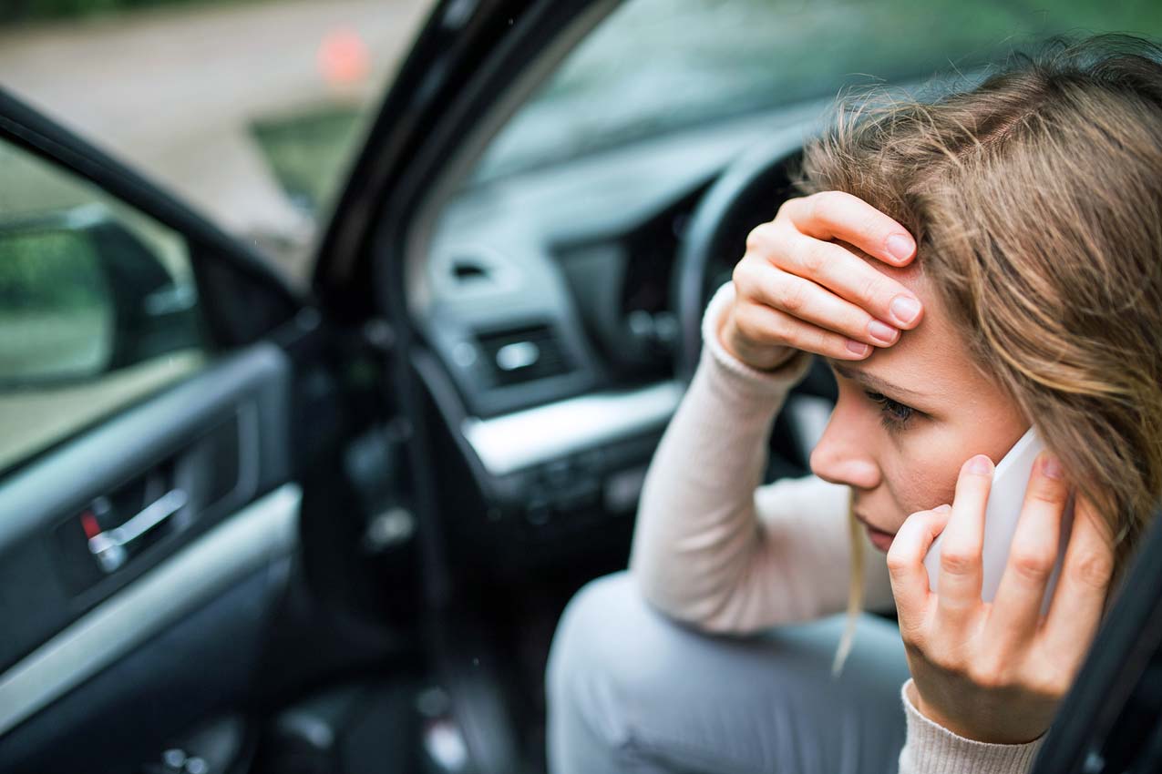 crying-young-girl-in-car-with-door-open-financial-troubles-on-side-of-road-needing-help