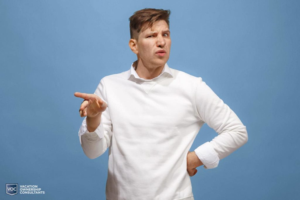 confused-looking-man-dress-shirt-wondering-what-the-point-of-something-is-with-hand-gesture-as-to-expect-more-information-or-misguidance