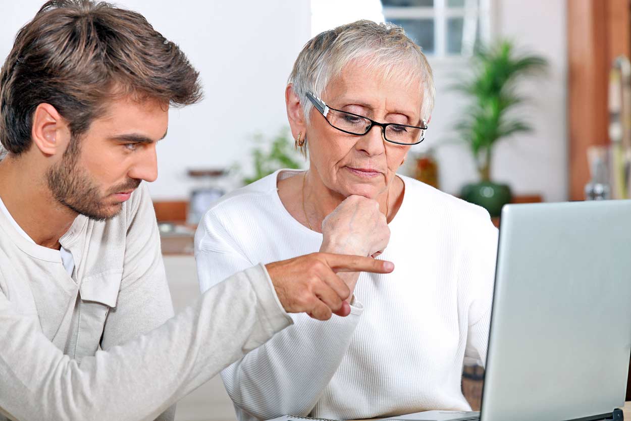 grandson-pointing-out-timeshare-exits-teams-with-bad-intentions-on-computer