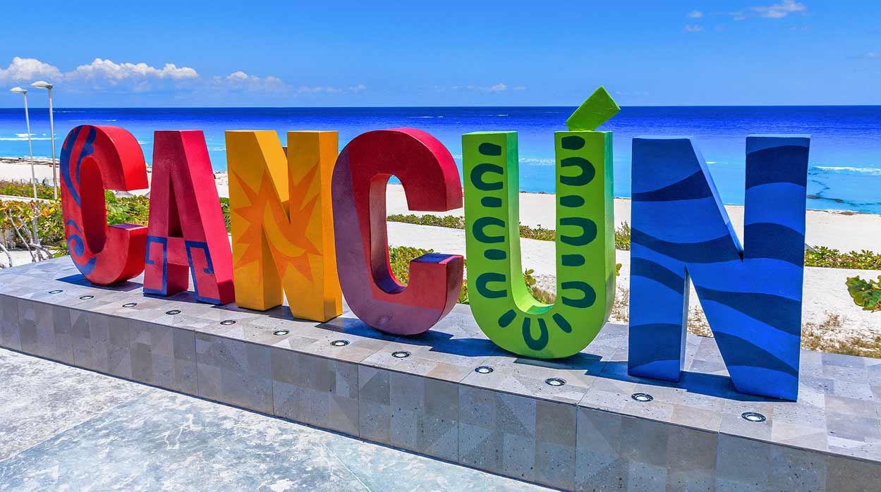 street-mexican-boardwalk-colorful-sign-for-cancun-destination-at-beach-for-tourists-to-take-picture-in-front-of