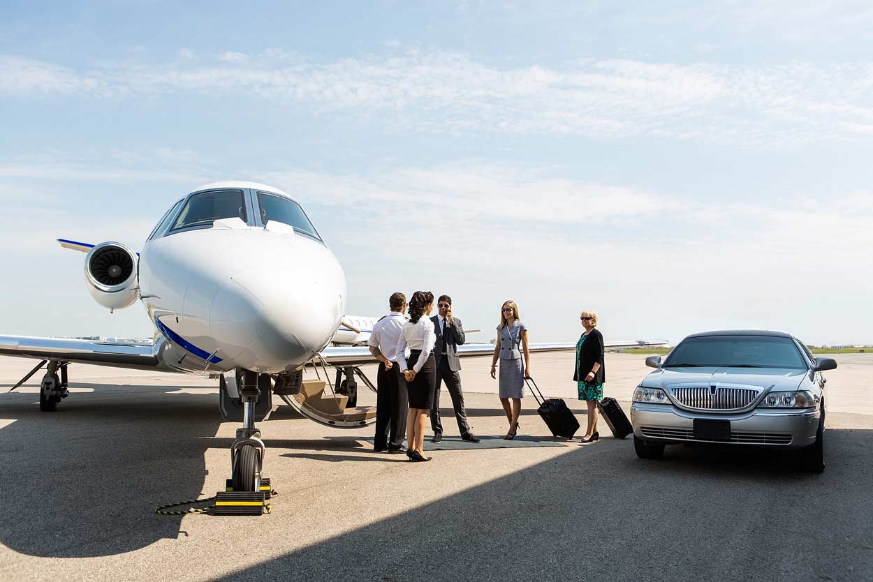 wealthy-party-exiting-cheoffer-car-to-enter-private-jet-for-acquisition-meeting-in-another-city-resort-location