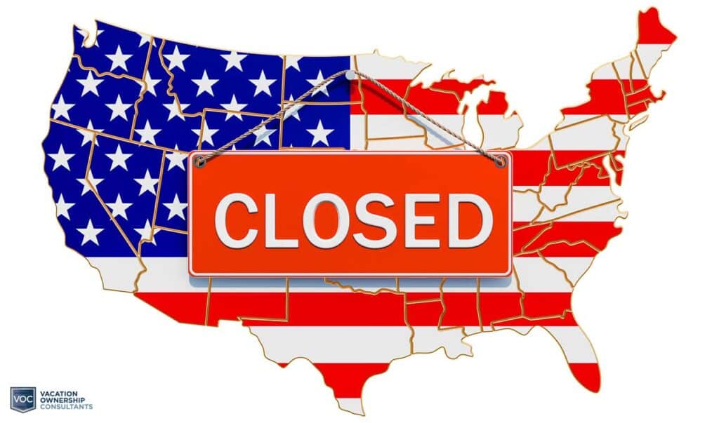 closed-door-sign-hanging-on-boundary-map-of-united-states-of-america-symbolizing-shut-down-economy-joe-biden