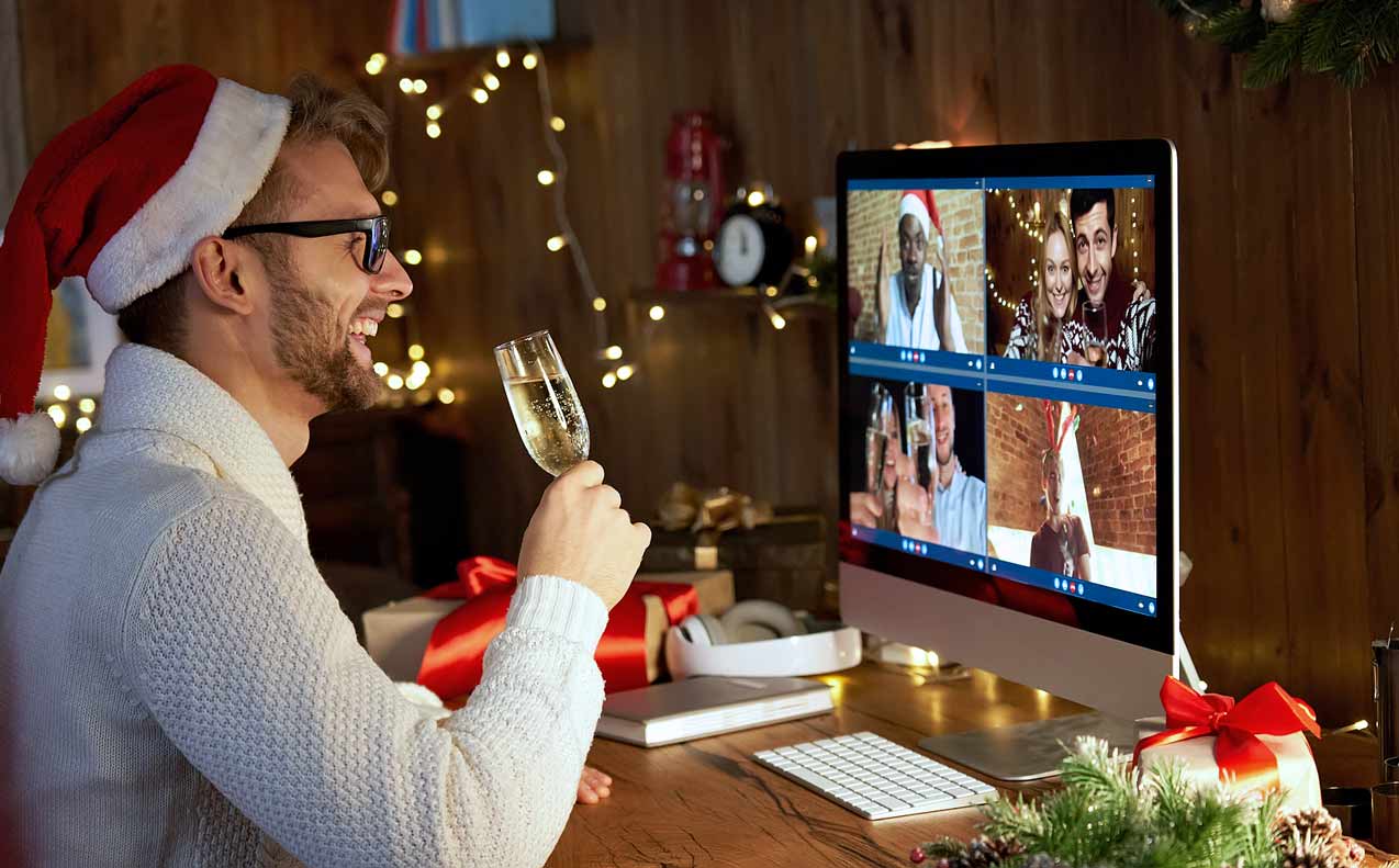 hopster-sipping-champaign-wearing-red-santa-hat-with-friends-during-virtual-party-with-holiday-lights-and-decorations-in-background