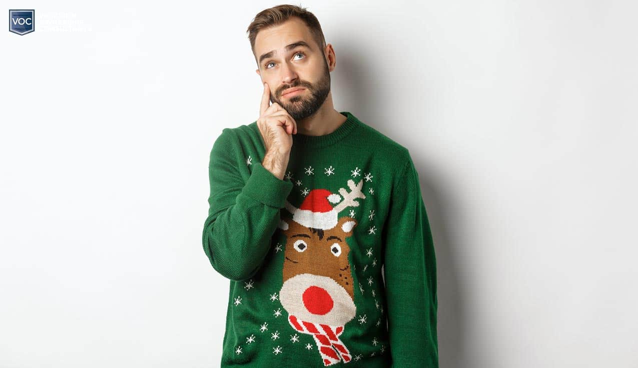 feminine-man-thinking-alone-during-christmas-while-wearing-holiday-goofy-sweater-for-no-reason-other-than-attention-on-social-media