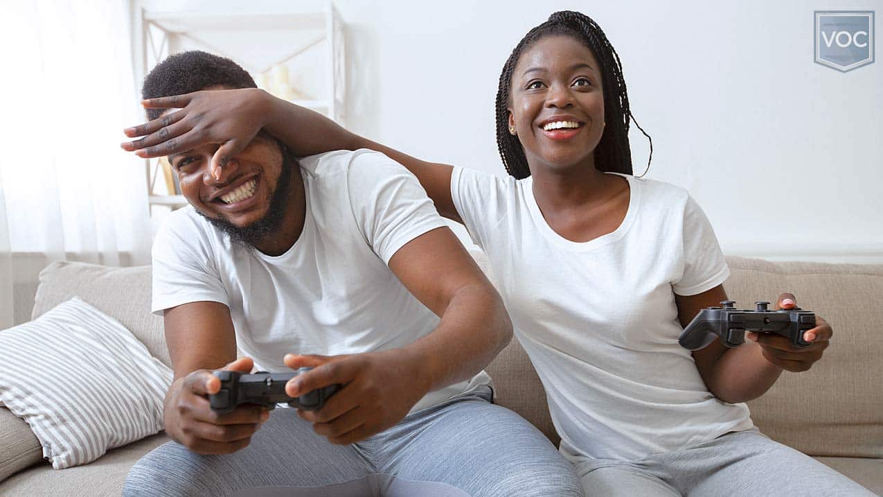 african-american-couple-in-sweats-playing-video-games-on-new-years-during-travel-lockdowns-while-timeshare-is-off-limits-things-to-do-for-fun-at-home
