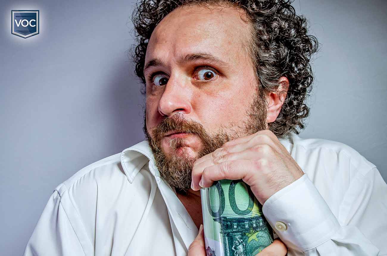 fearful looking curly haired man holding tightly to jar of money not wanting to give any of it away to pay timeshare dues